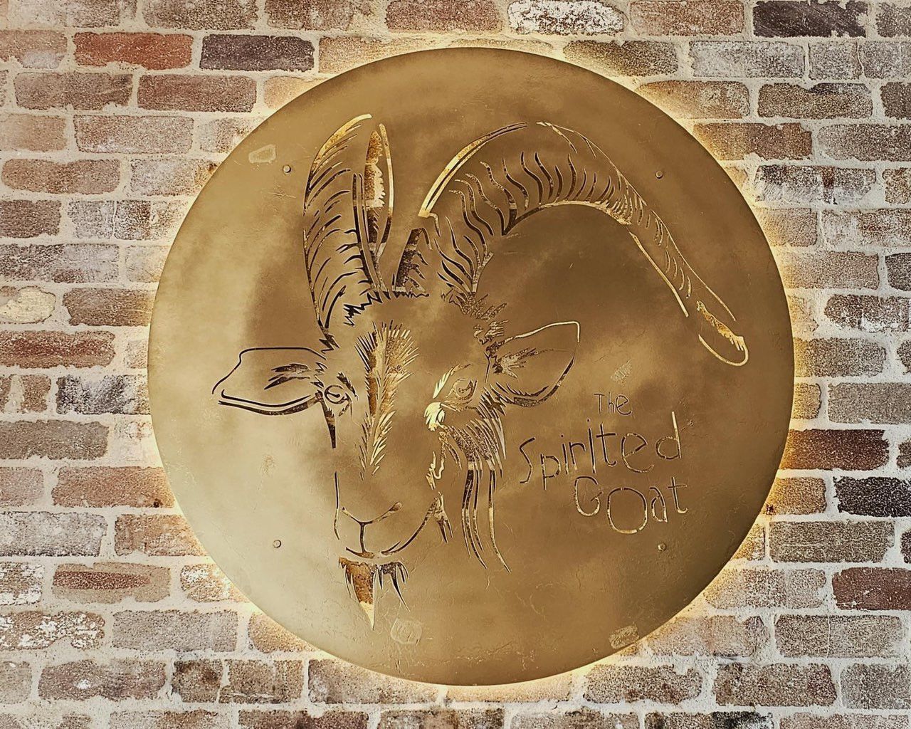 A Stainless Steel Sign With Lights Behind It That Says The Spirited Goat — Bigdog Welding and Fabrication Pty Ltd In Currajong, QLD
