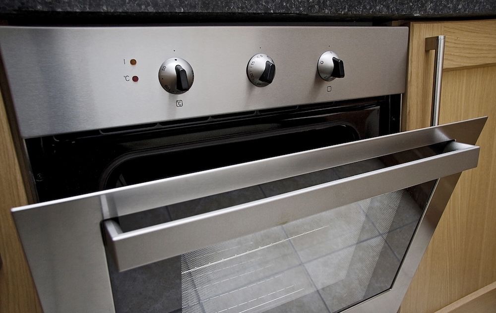 A Silver Oven with the Door Open — Brightway Electrical in Alstonville, NSW