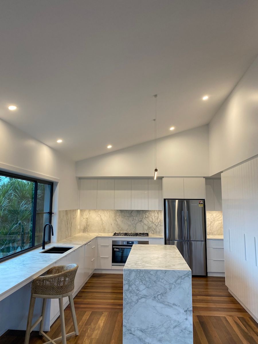 A Kitchen with Lights on an Angular Roof — Brightway Electrical in Bangalow, NSW