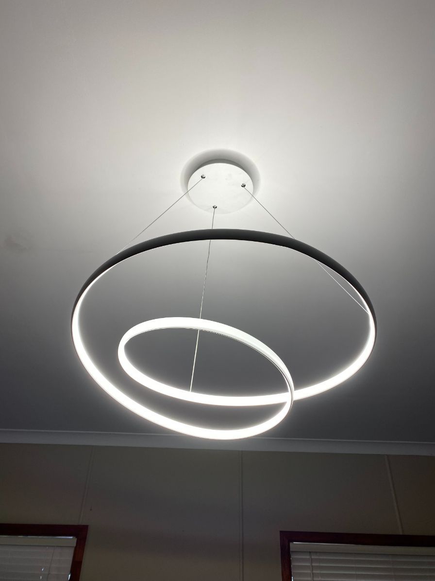 A Ceiling Light With Three Circles Hanging From It — Brightway Electrical in Ballina, NSW