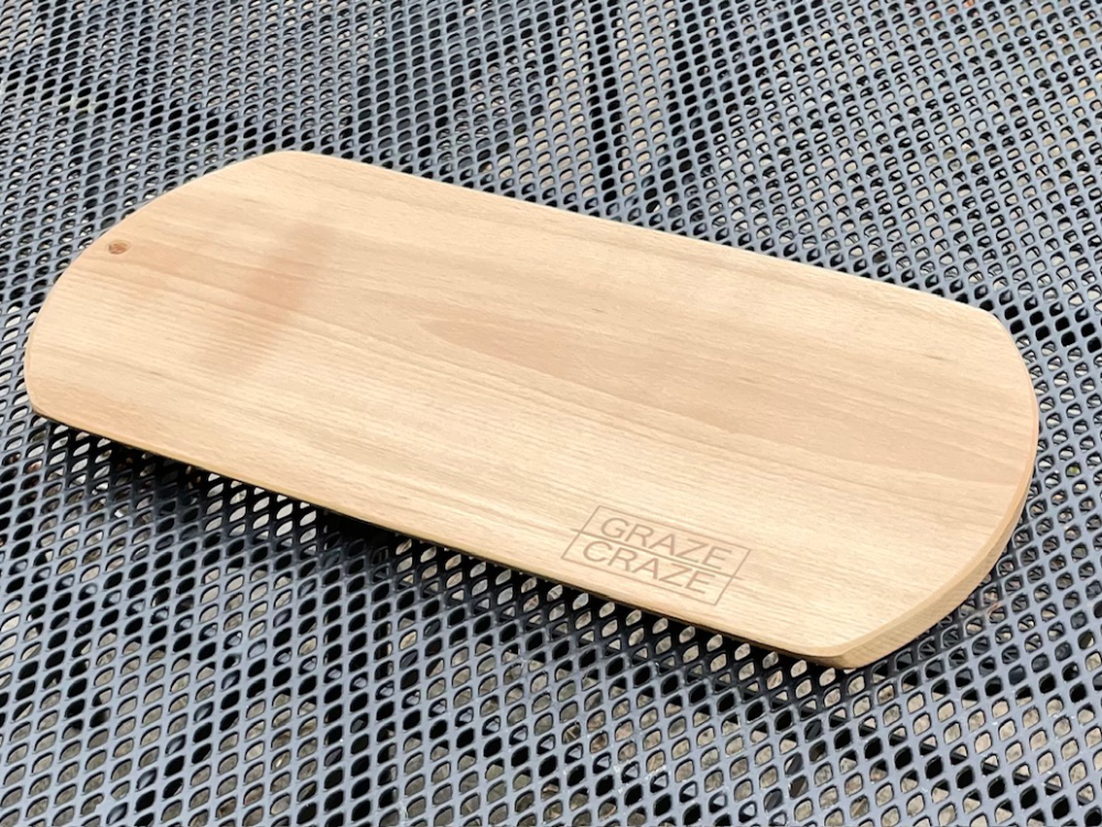 Wooden chopping board with rounded edges, engraved with