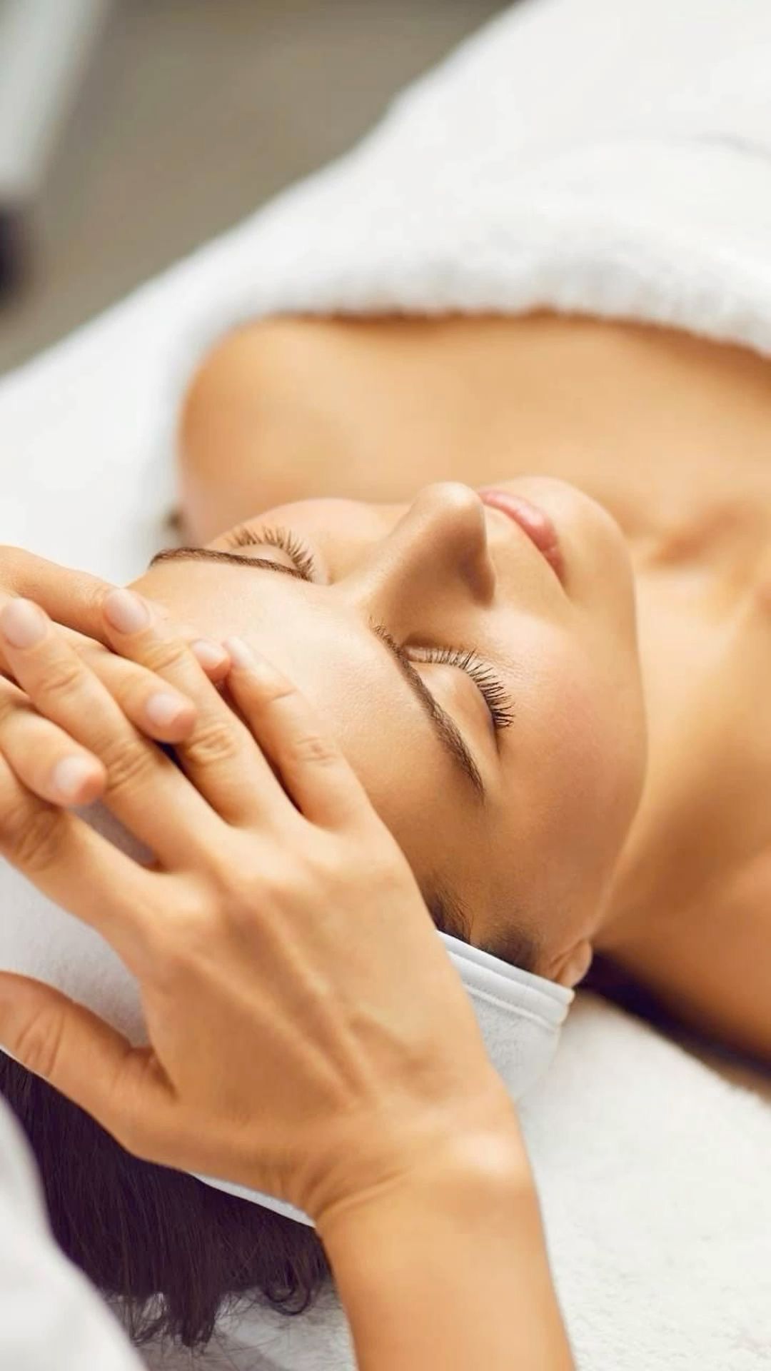 A Woman is Getting a Facial Treatment at a Spa — Cosmo Hair & Beauty In Nambour, QLD