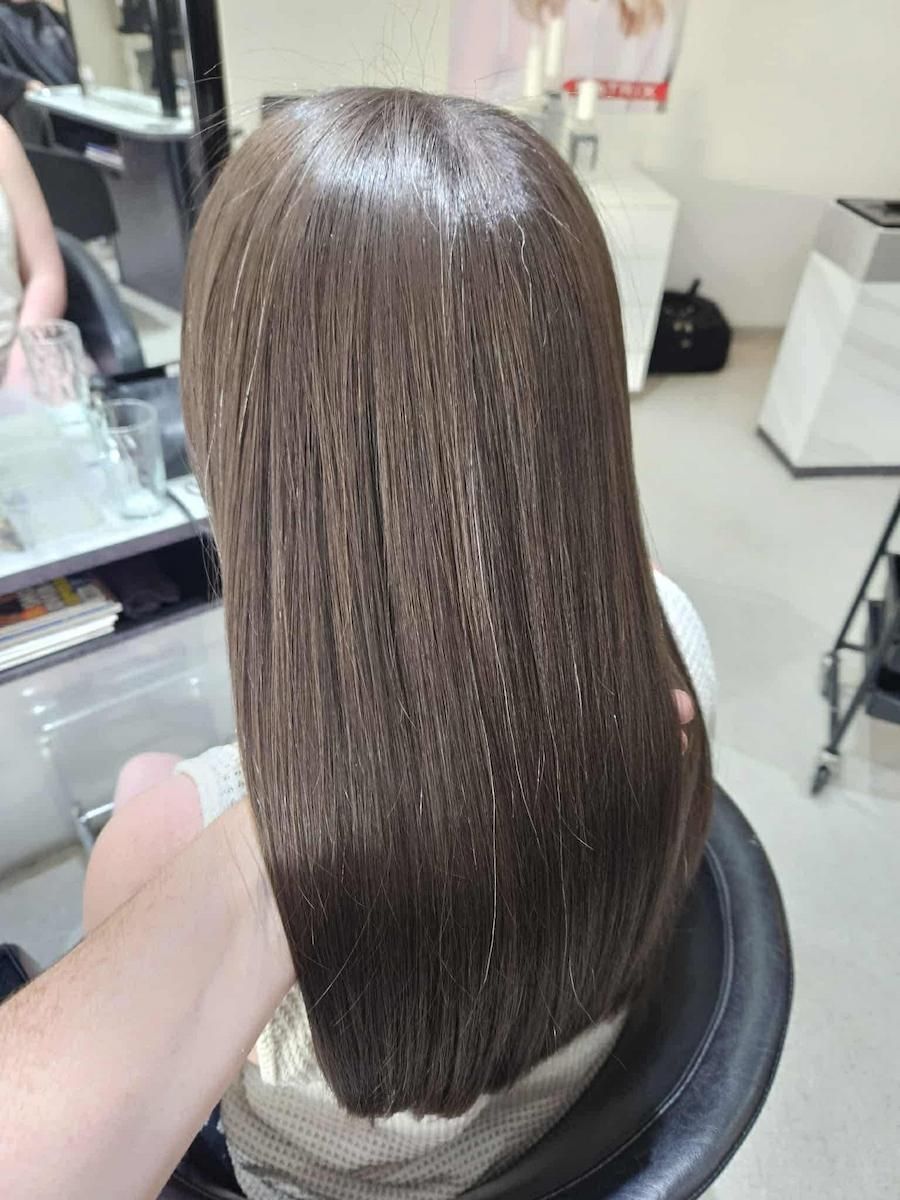 Back View Of A Smooth, Straight Brown Bob Haircut In A Salon Chair — Cosmo Hair & Beauty In Nambour, QLD