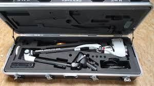 A portable, long-reach articulated inspection arm in a black, foam-lined carrying case.