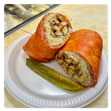 Adamm's Delli Wrap on a plate with a pickle