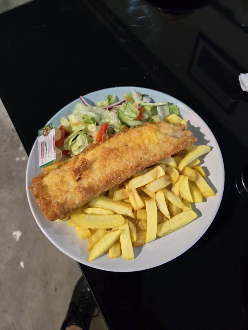 A Plate of Fish and Chips With a Salad on a Table — Deep Sea Delights in Taree, NSW