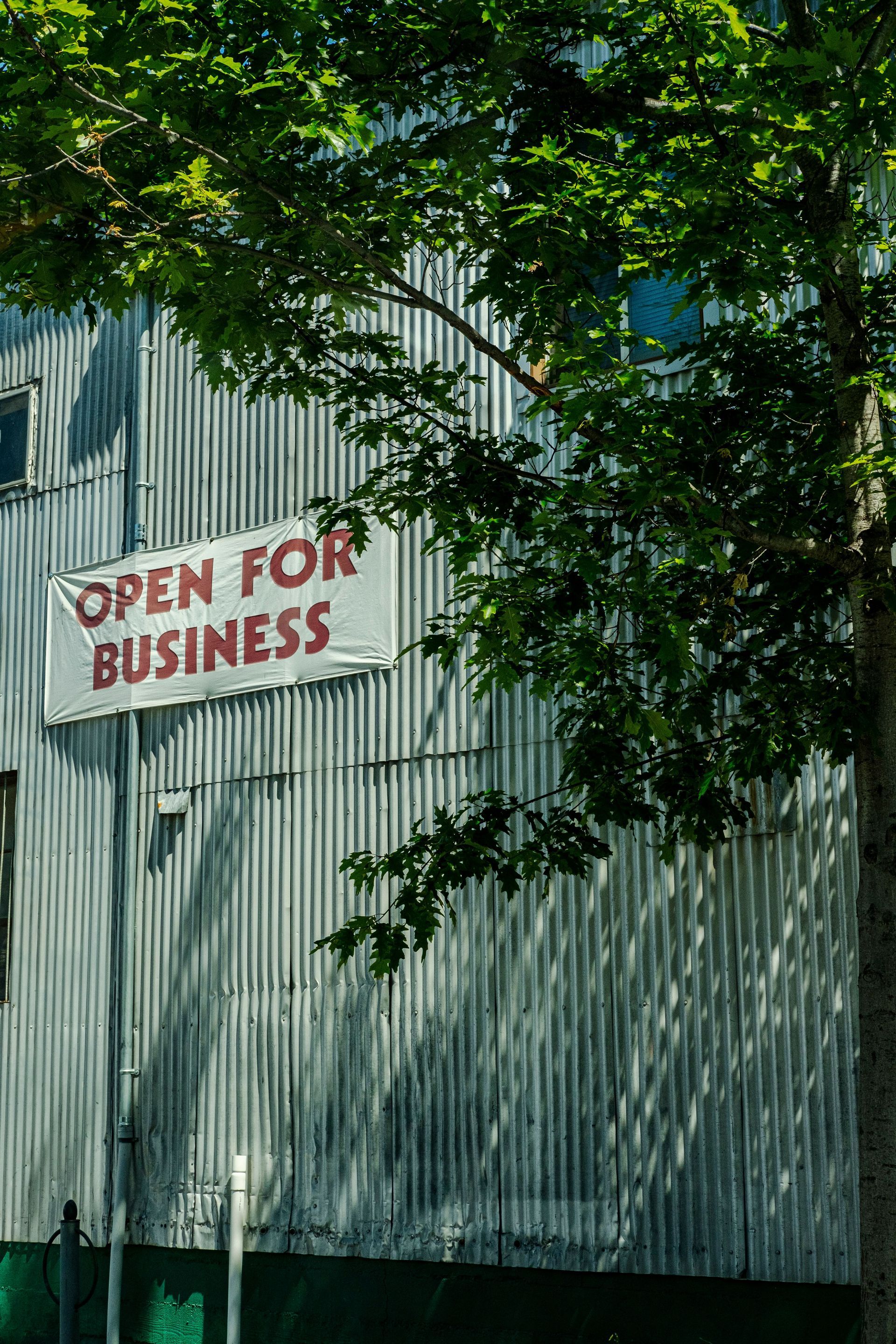 Warehouse with an aluminum exterior and a banner stating