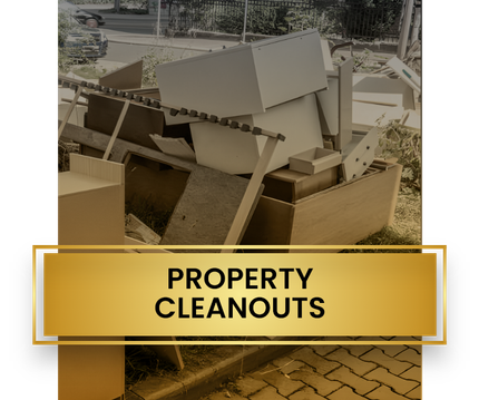 A pile of property cleanouts is sitting on the side of the road.