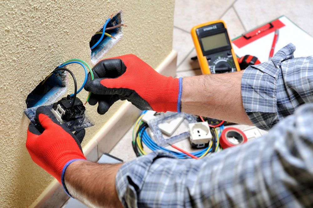 Electrician Installing Cables — Electrician in Albury, NSW