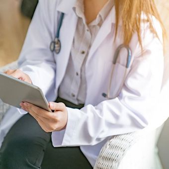 Doctor Using Digital Tablet — Colorado Springs, CO — Dynamic Family Medicine Doctor Using Digital Tablet — Colorado Springs, CO — Dynamic Family Medicine