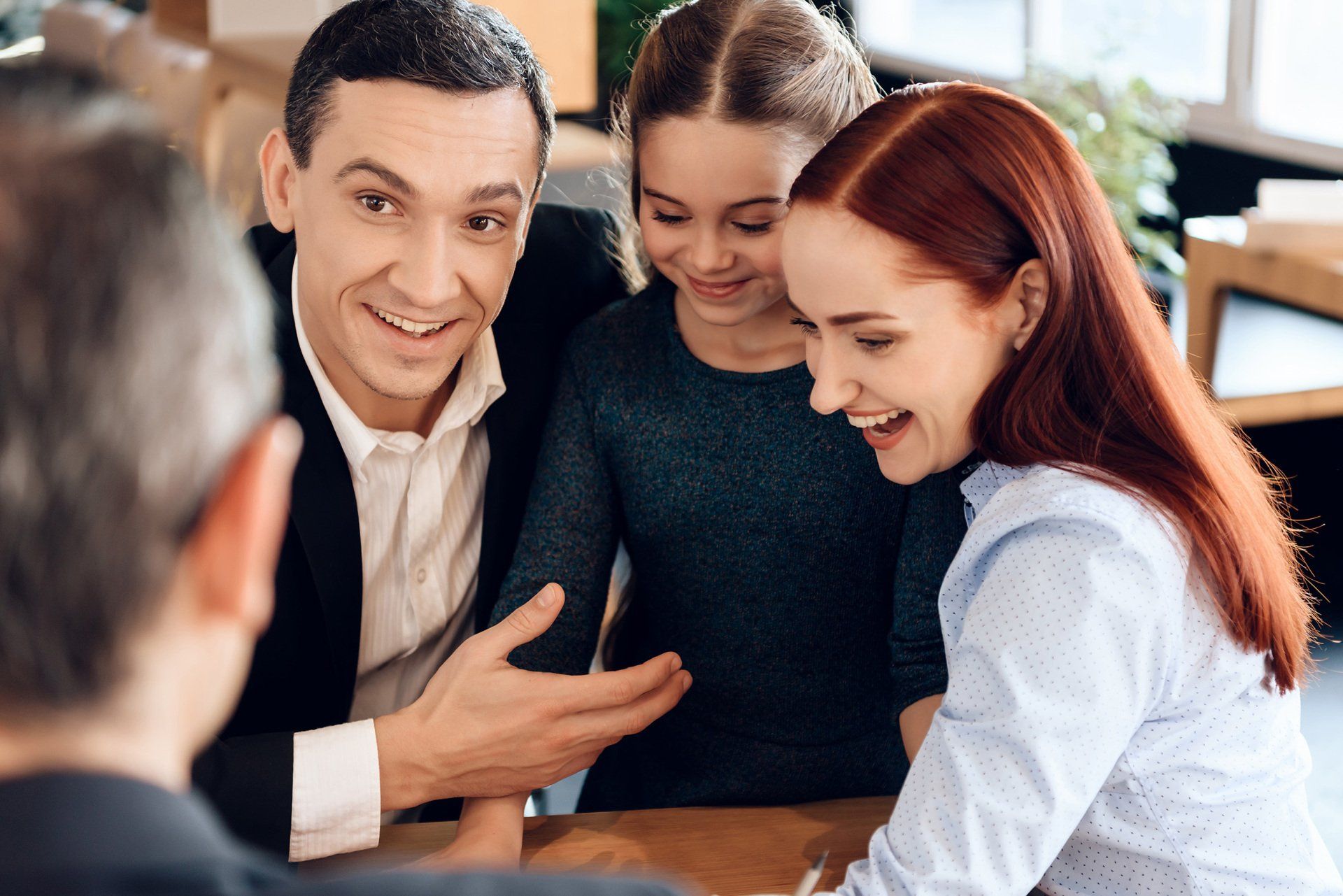 young happy family received cash compensation