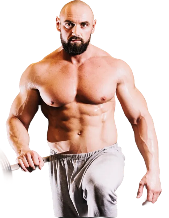Muscular shirtless man posing in gray sweatpants, holding a dumbbell on a white background