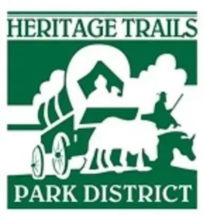 Heritage Trails Park District logo in green and white with wagon, barn, trees, and grazing animals