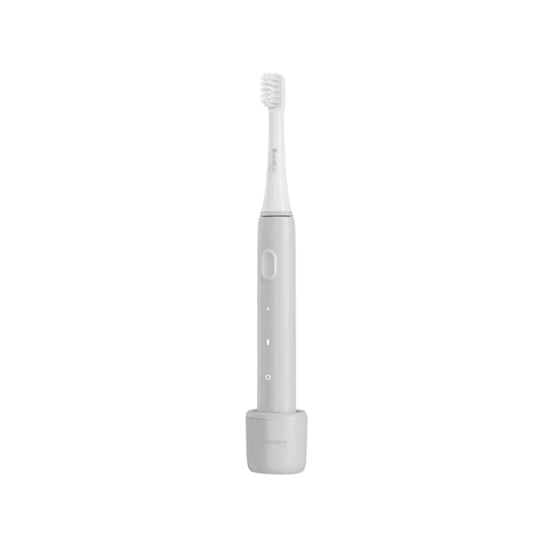Cepillo de dientes eléctrico, color gris, sobre base de carga.