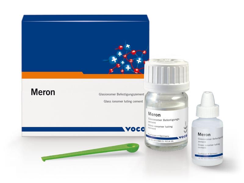 Caja y frascos de cemento dental Meron, con cuchara mezcladora.