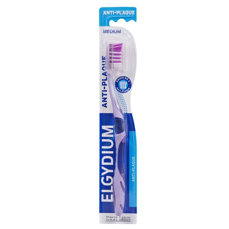 Cepillo de dientes Elgydium antiplaca azul y blanco en envase para la venta al público.