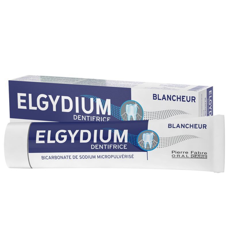 Dos tubos de pasta de dientes blanqueadora Elgydium, uno blanco y otro azul, sobre un fondo blanco.
