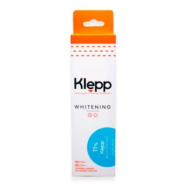 Caja de pasta de dientes blanqueadora Klepp con tapa naranja y envase blanco, con un círculo azul como detalle decorativo.