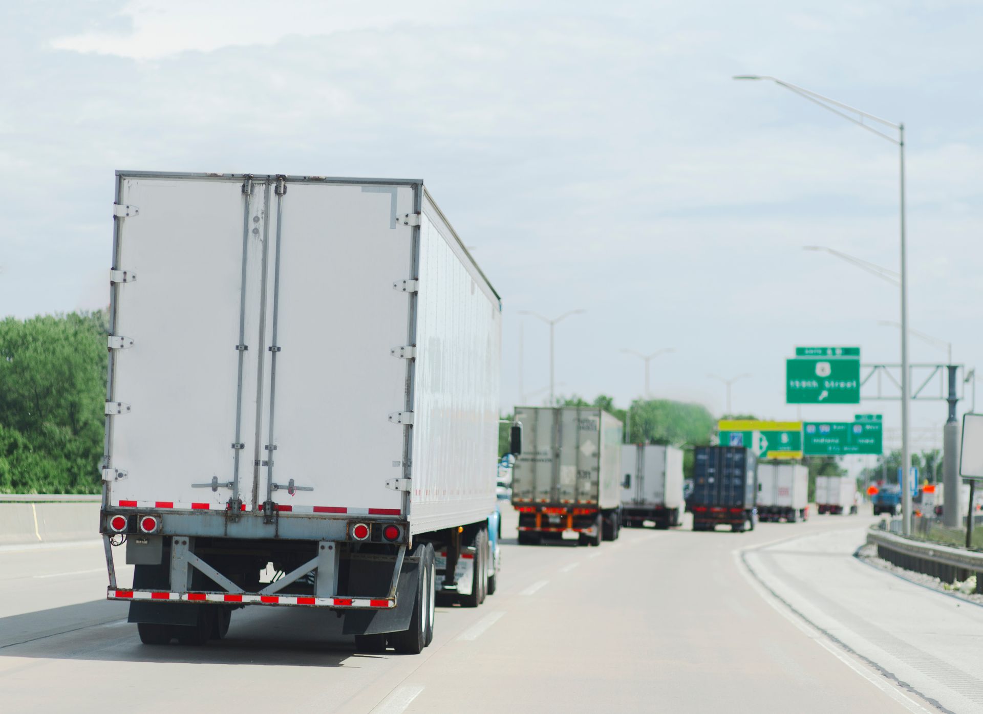 A trip semi truck is driving down a highway