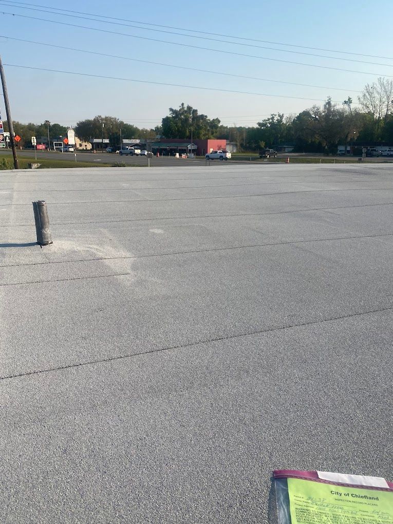 A large empty parking lot with a lot of cars parked in it.
