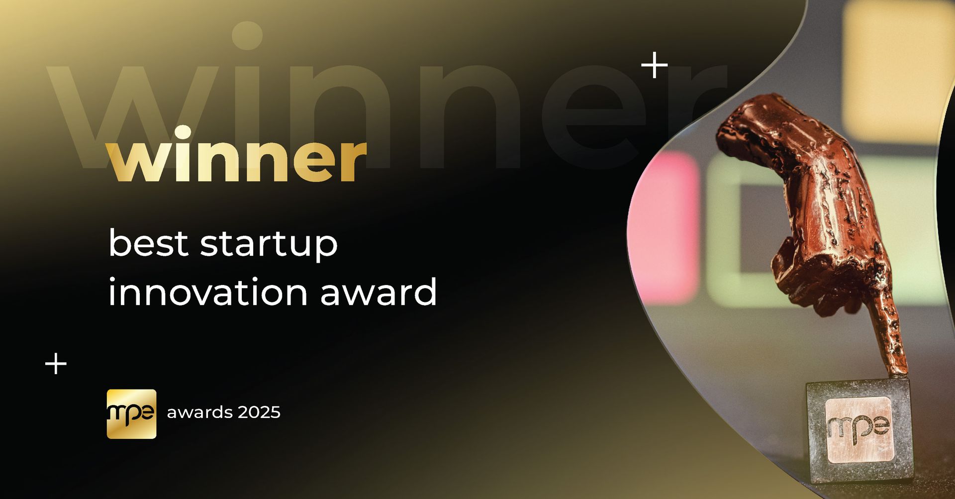 Winner text for best startup innovation award beside a gold trophy on a black and gold background