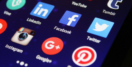 Smartphone screen displaying social media app icons, including Facebook, Instagram, Twitter, and LinkedIn.