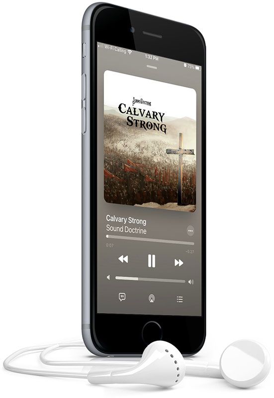 A cell phone with headphones attached to it is playing calvary strong.