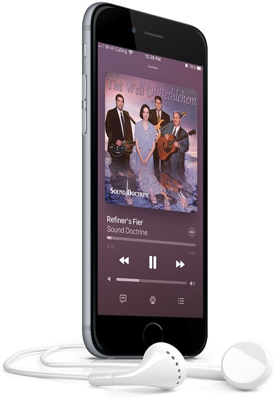 A cell phone with headphones attached to it is playing a song.