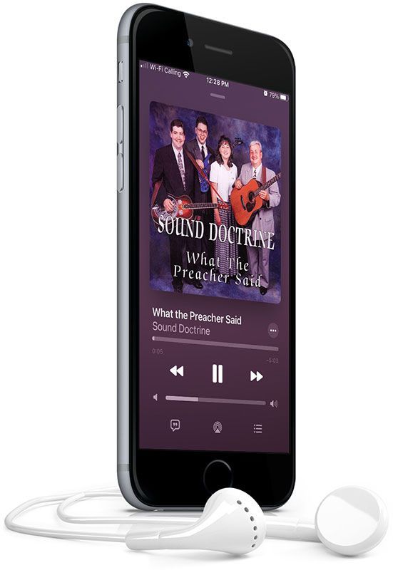 A cell phone with headphones attached to it is playing a song.