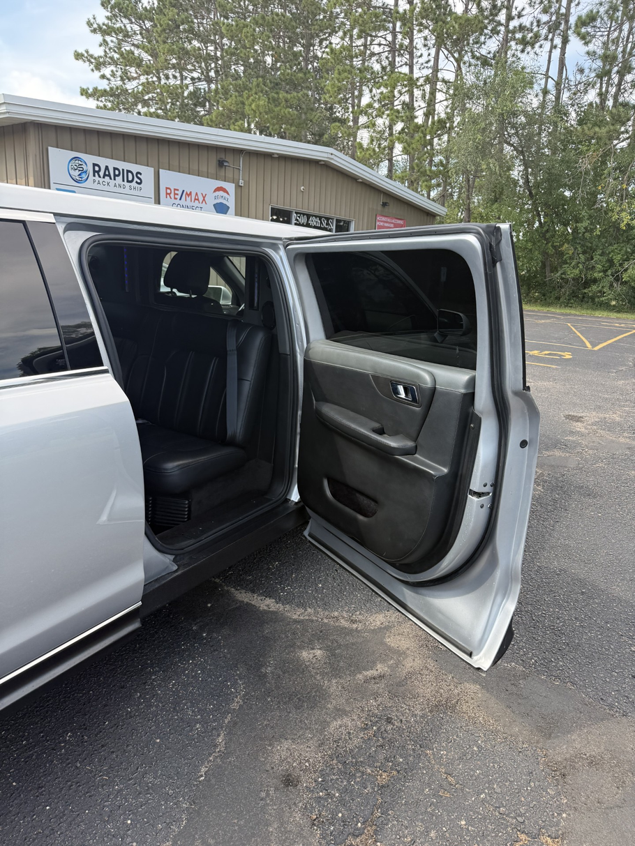 Silver stretch limousine on a white background