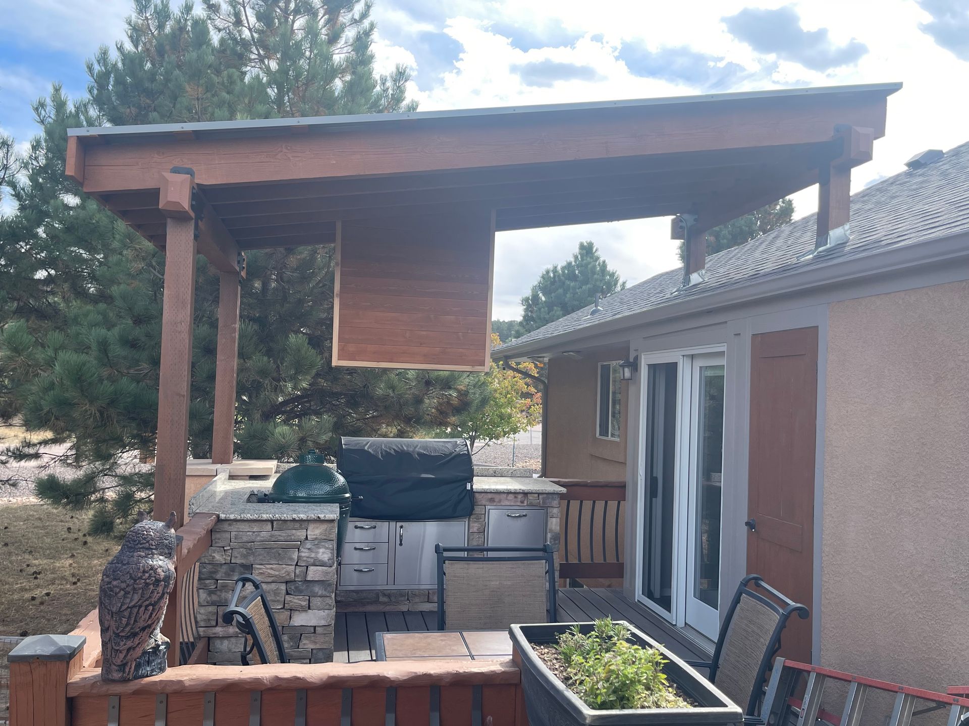 There is a grill on the roof of the house.