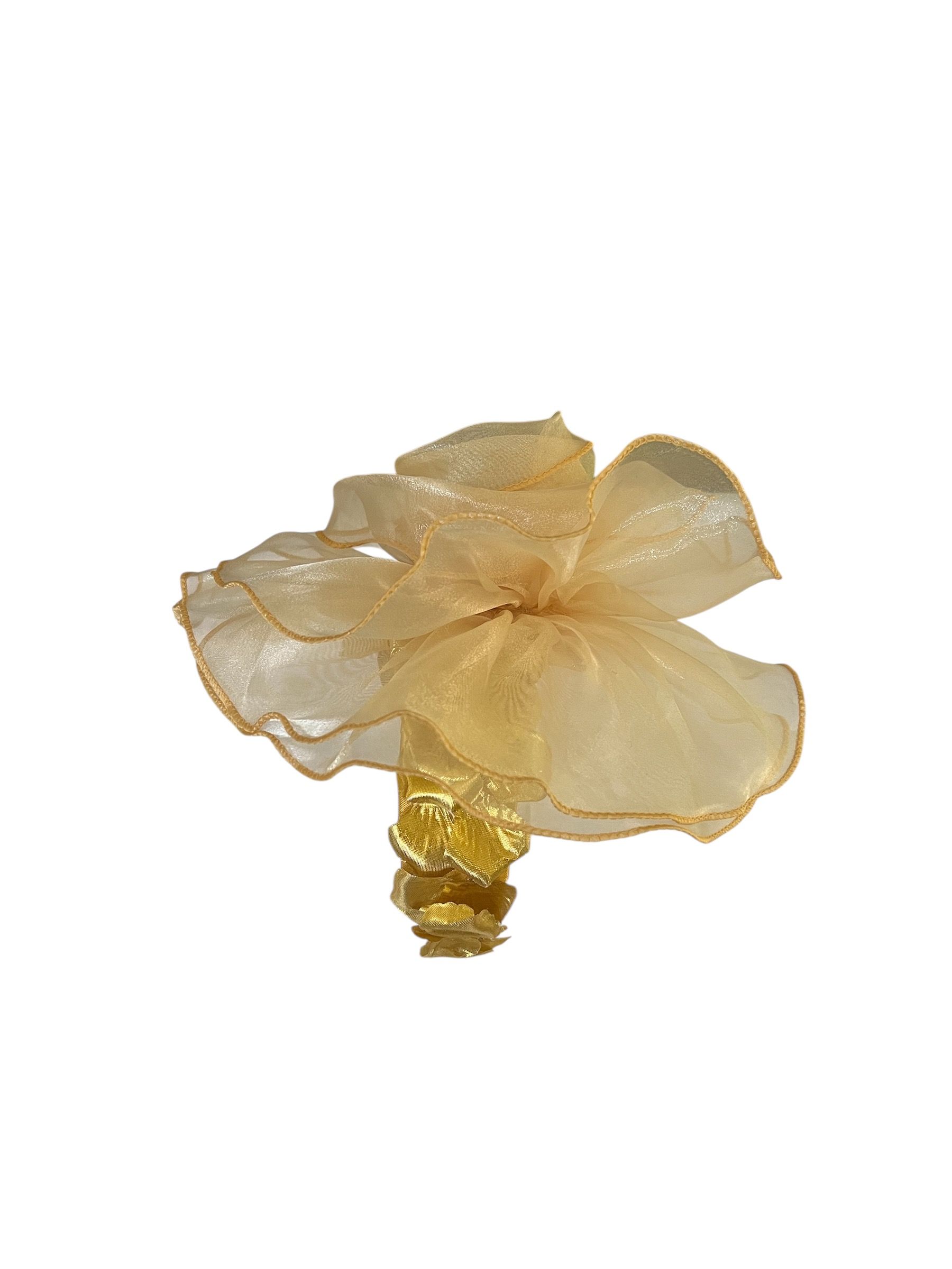 White flower with layered petals and a gold center on a plain background