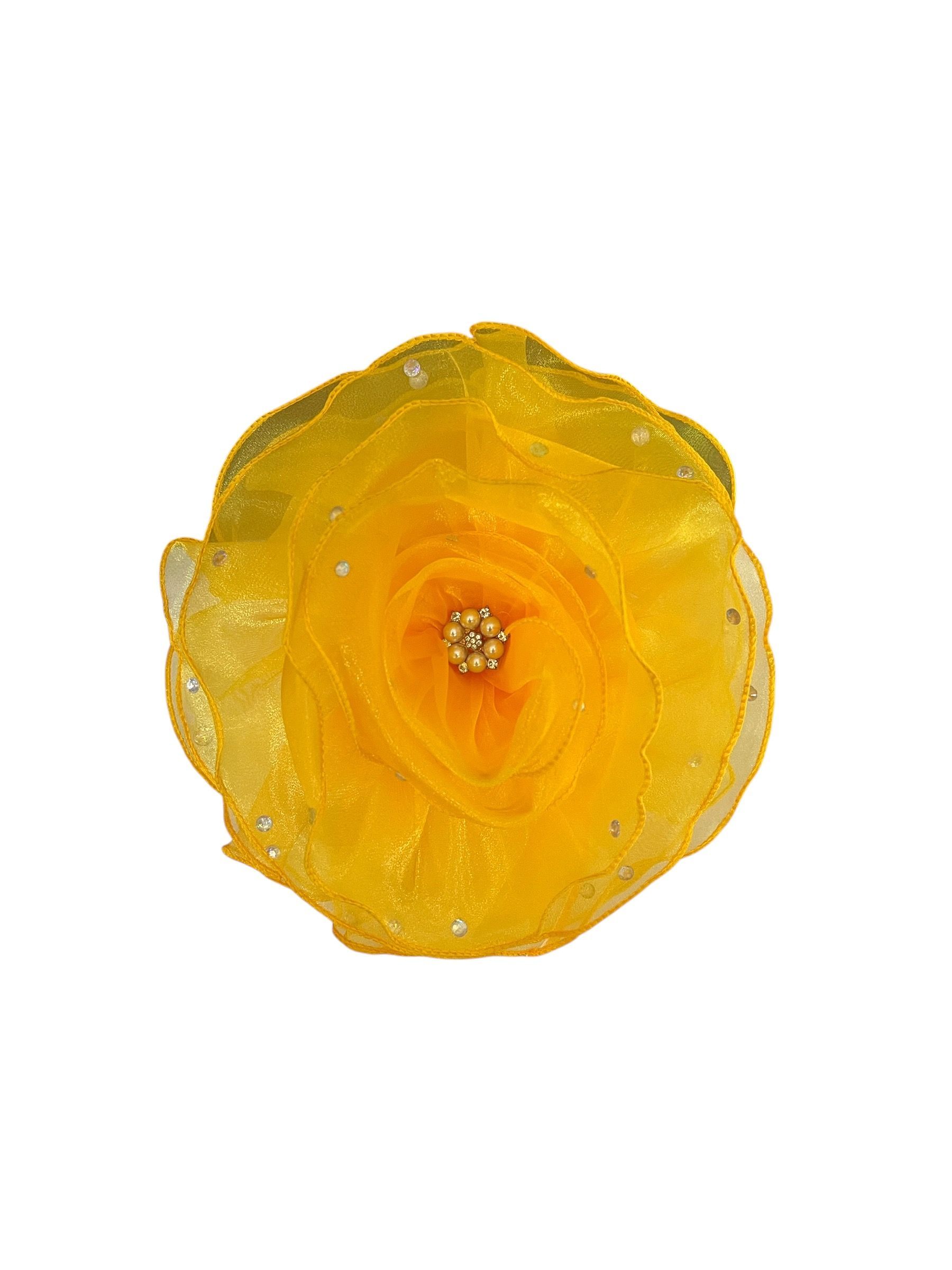 Yellow rose blossom centered on a white background