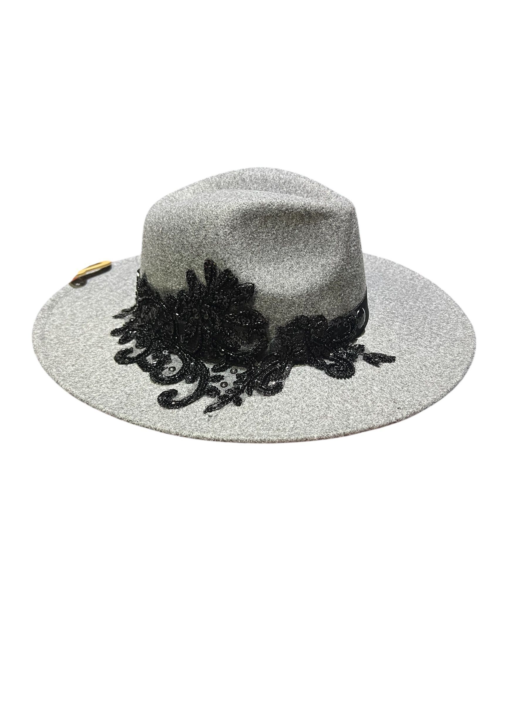 black cowboy style hat with black lace embellishment