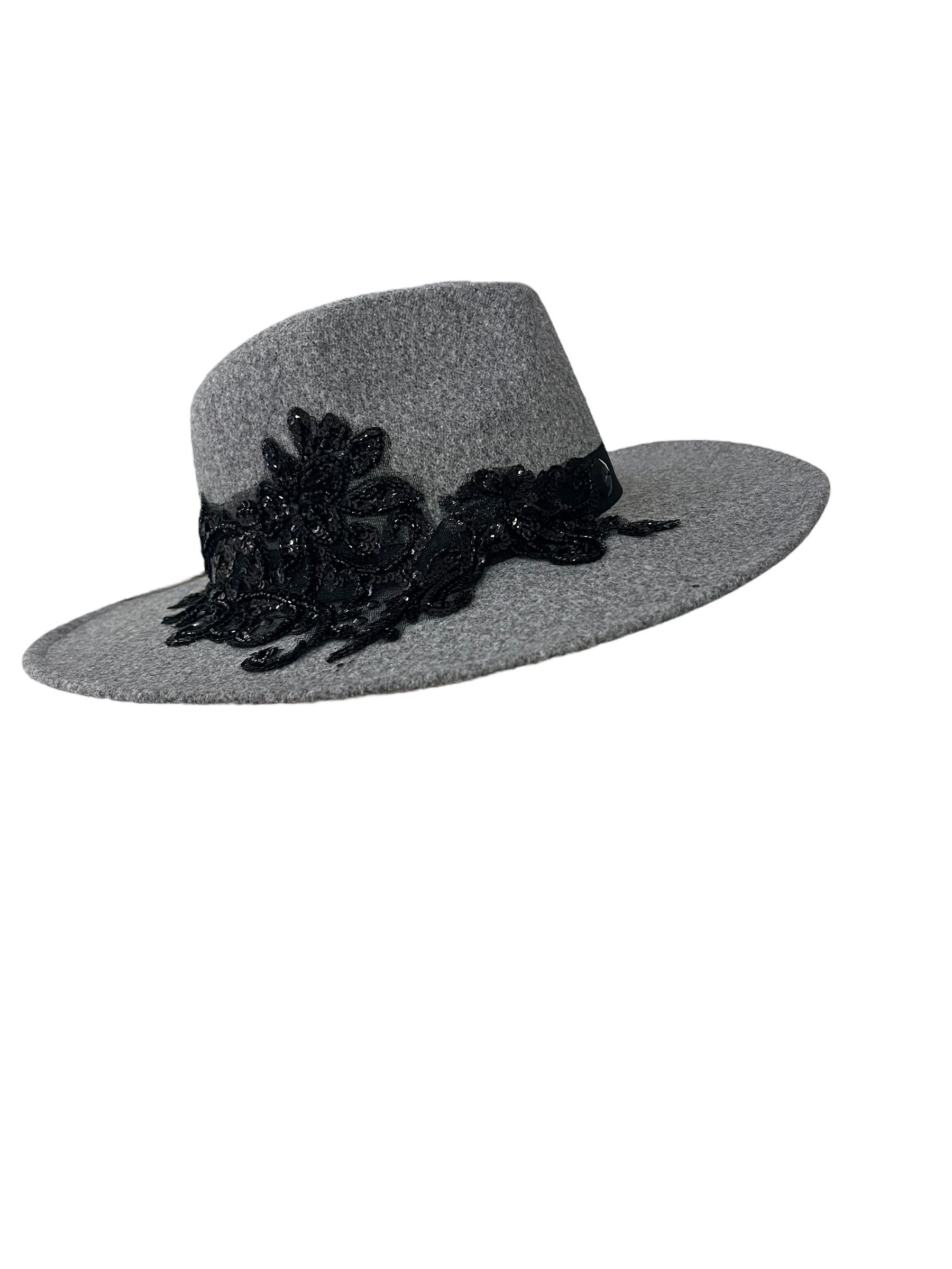 black cowboy style hat with black lace embellishment