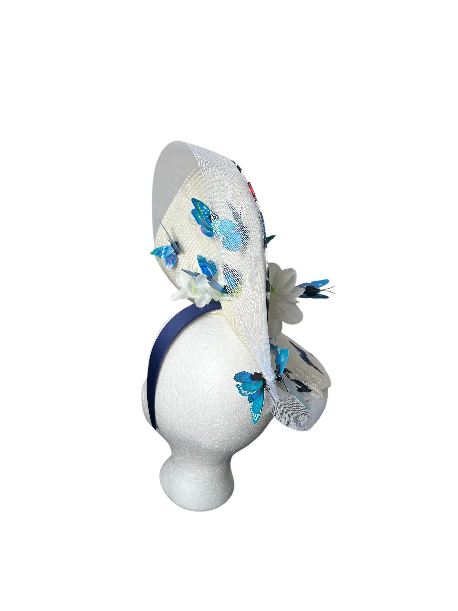 Decorative white chair with blue and red butterfly pattern and white floral embellishments