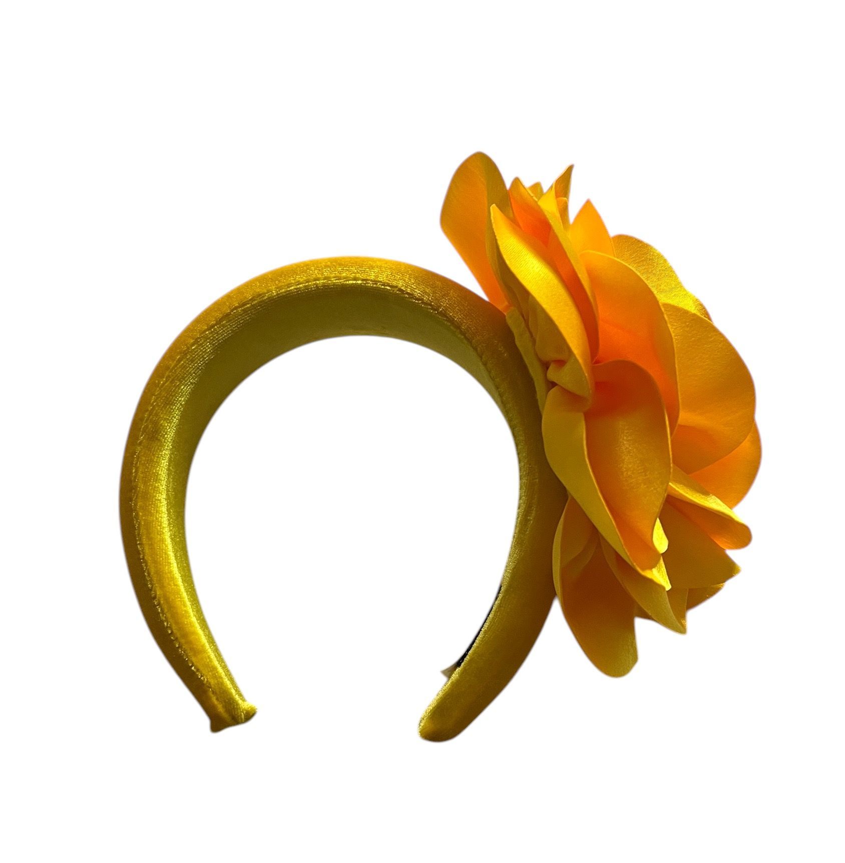 Yellow-orange satin flower with layered petals on a white background