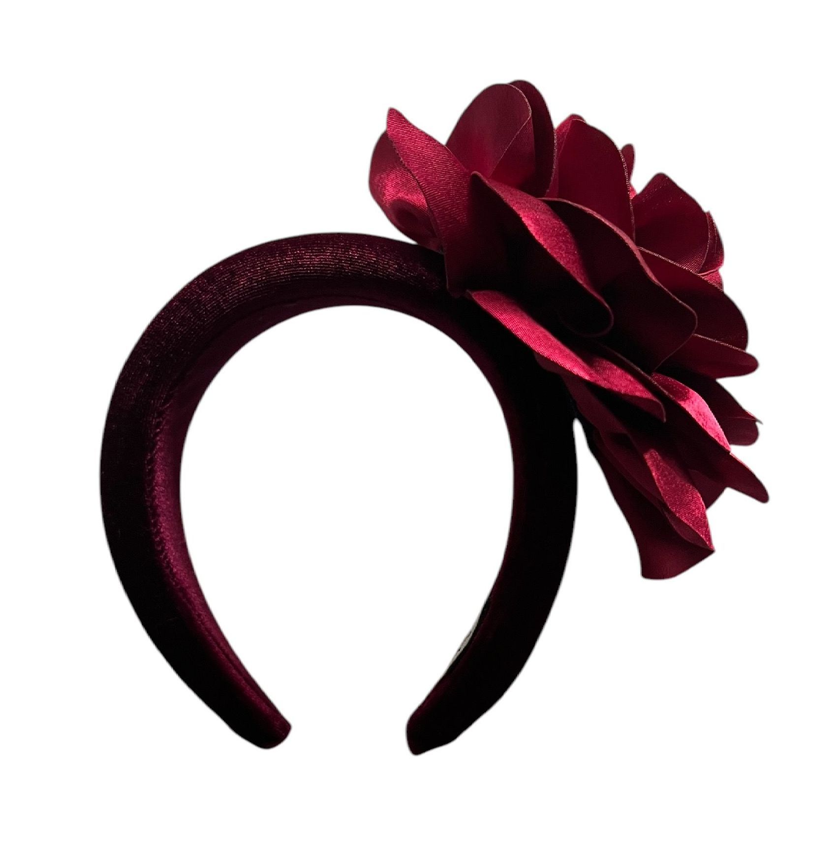 Dark red satin ribbon flower brooch on a white background