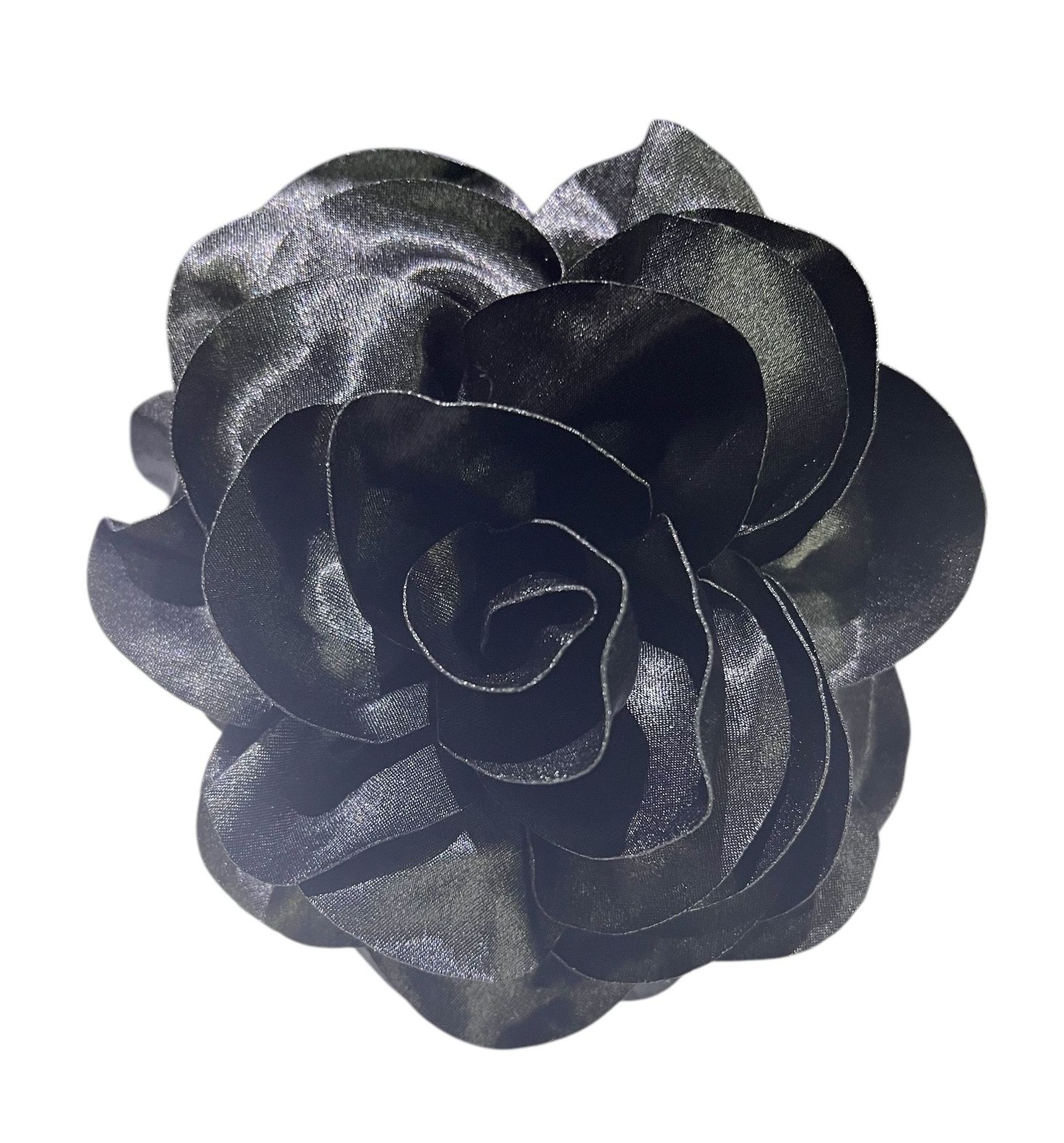 Black fabric flower with layered petals on a white background