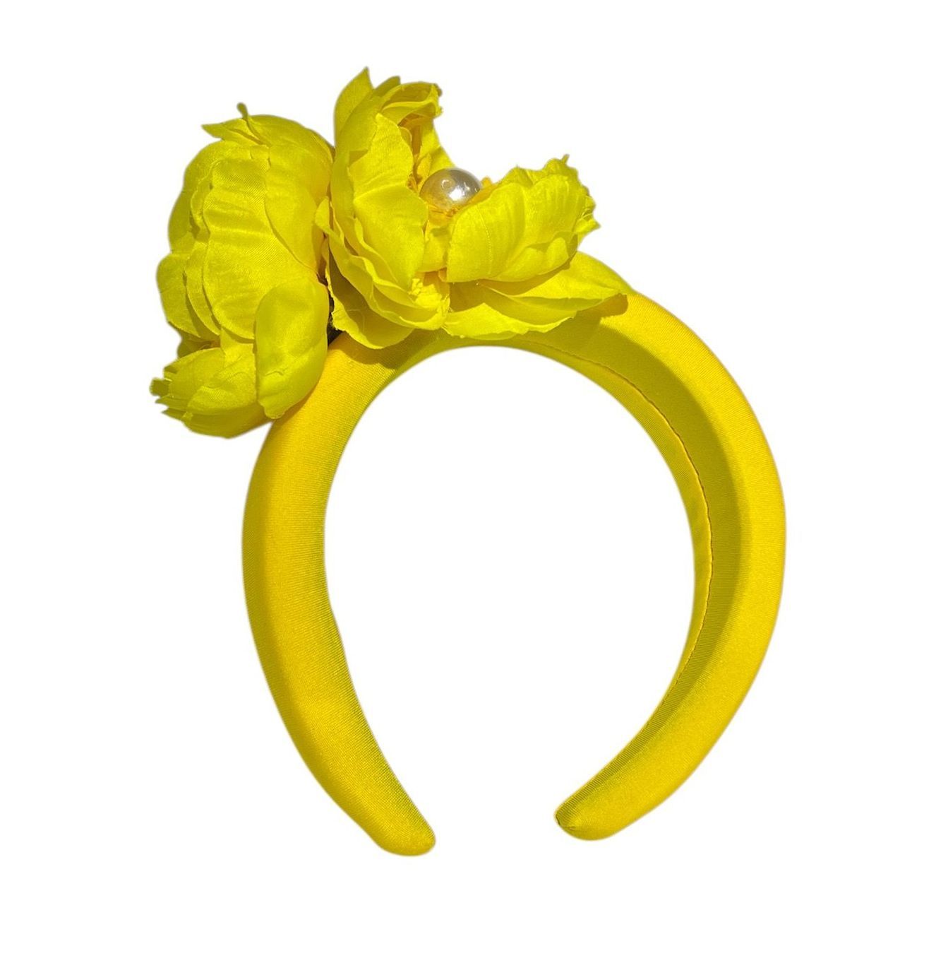 Yellow and orange flower with layered petals and a pearl center on a white background