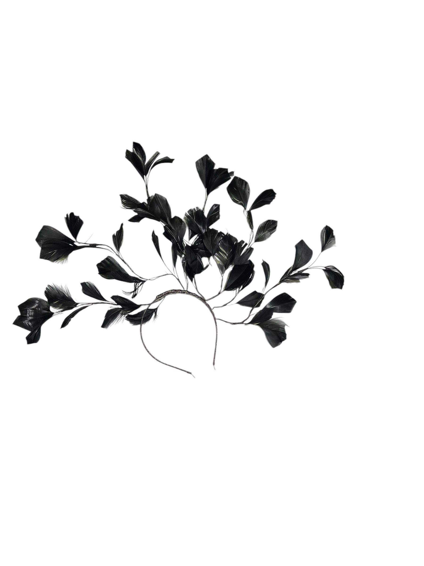 Black leafy branch silhouette on a white background