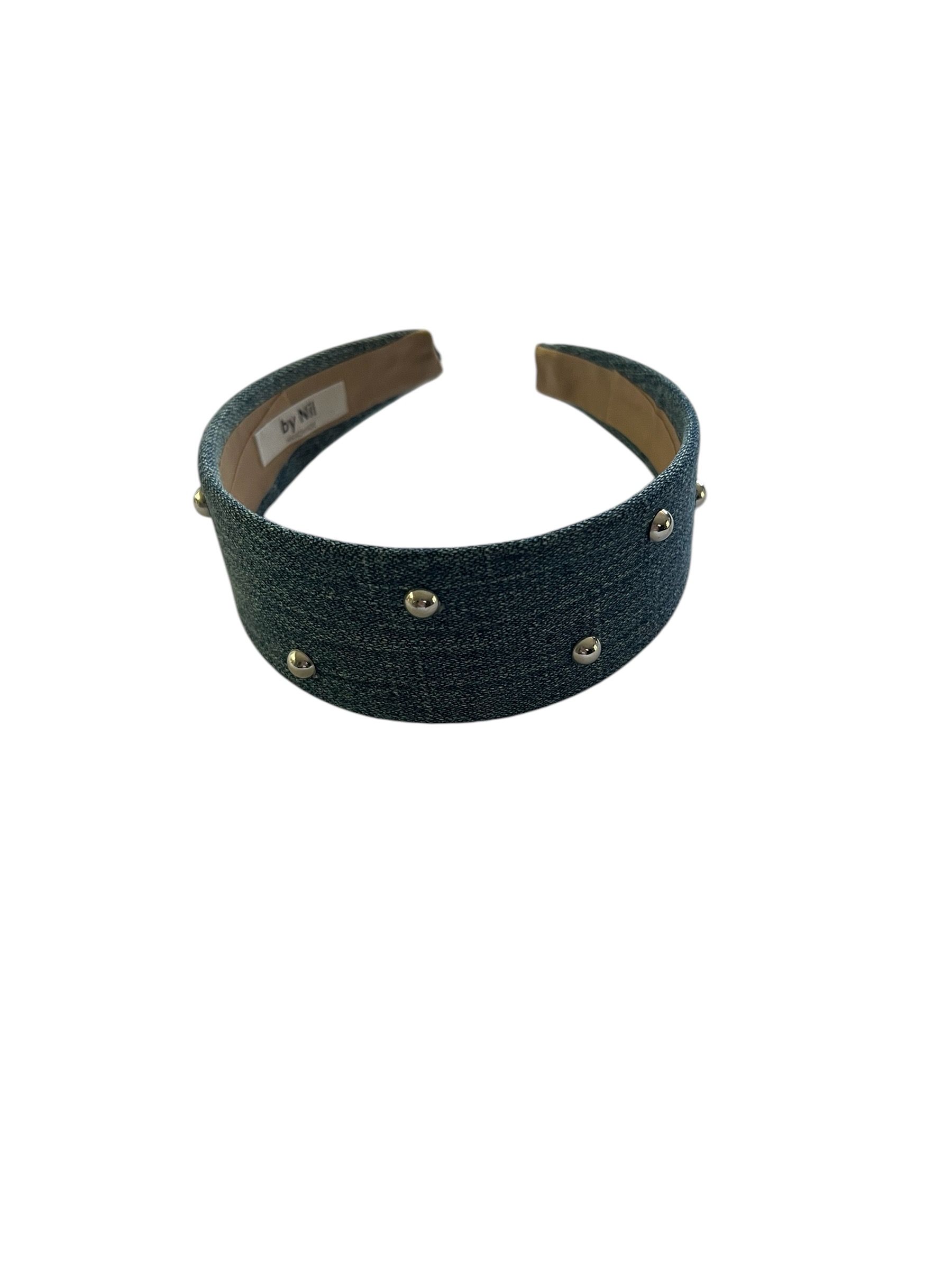 Dark blue jeweled headband with a brown interior, isolated on a white background