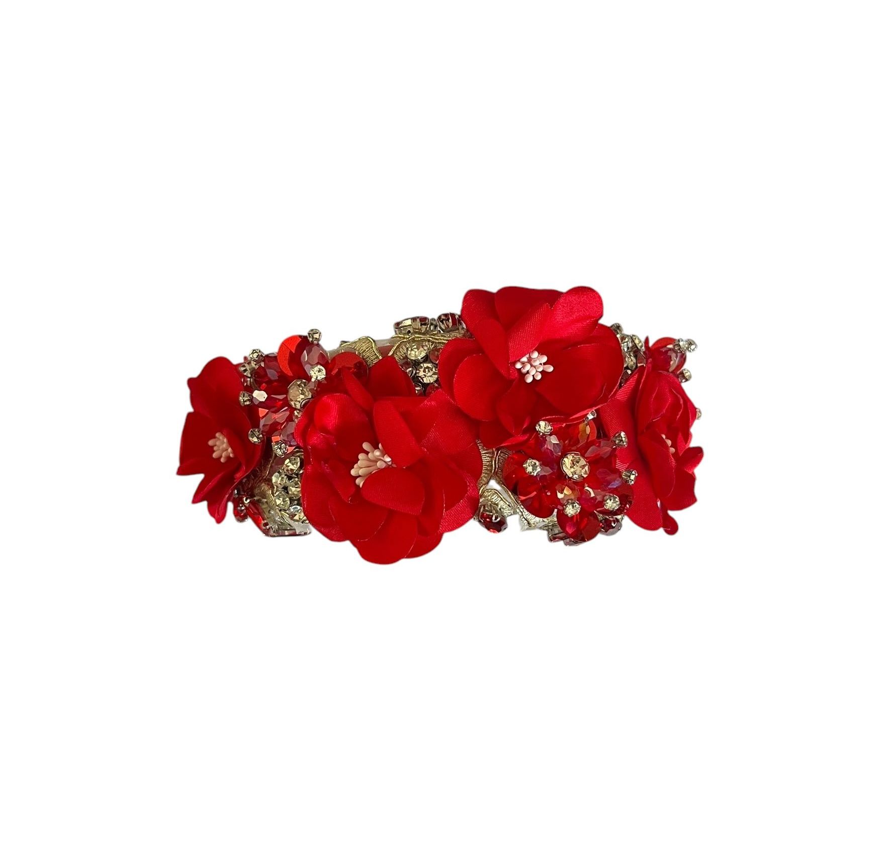 Red floral jeweled bracelet with gold accents on a white background