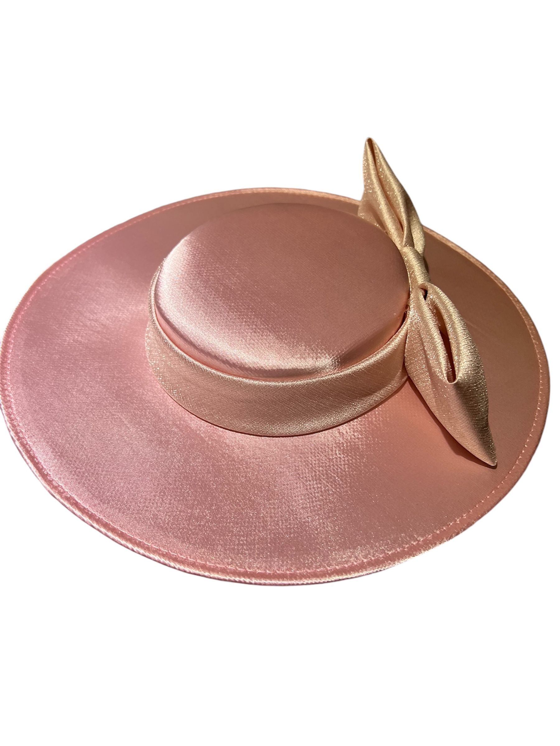 Pink glittery wide-brim hat with a round crown and feather accent