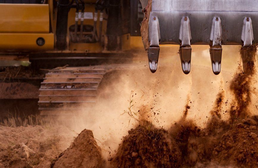 A Bulldozer Is Digging A Hole In The Ground — Sal's Excavations In Falls Creek, NSW