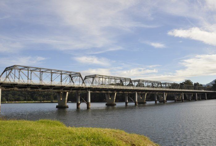A Bridge Over A Body Of Water With A Blue Sky In The Background — Sal's Excavations In Nowra, NSW