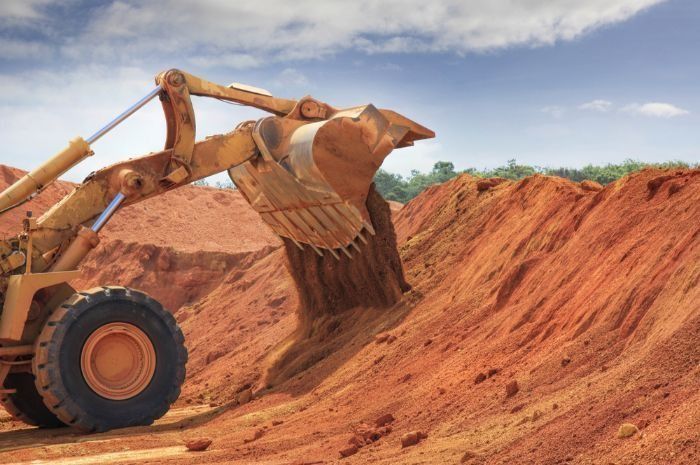 A Bulldozer Is Scooping Dirt From A Pile Of Dirt — Sal's Excavations In Vincentia, NSW