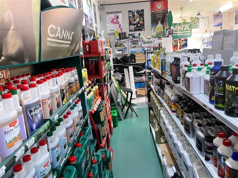 Shelves Stocked With Various Bottles of Plant Nutrients in a Retail Store — Cairns Hydroponics In Bungalow, QLD