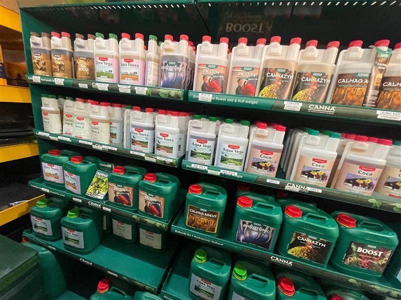 Shelves Stocked With Various Plant Fertilizers and Boosters in a Store — Cairns Hydroponics In Bungalow, QLD