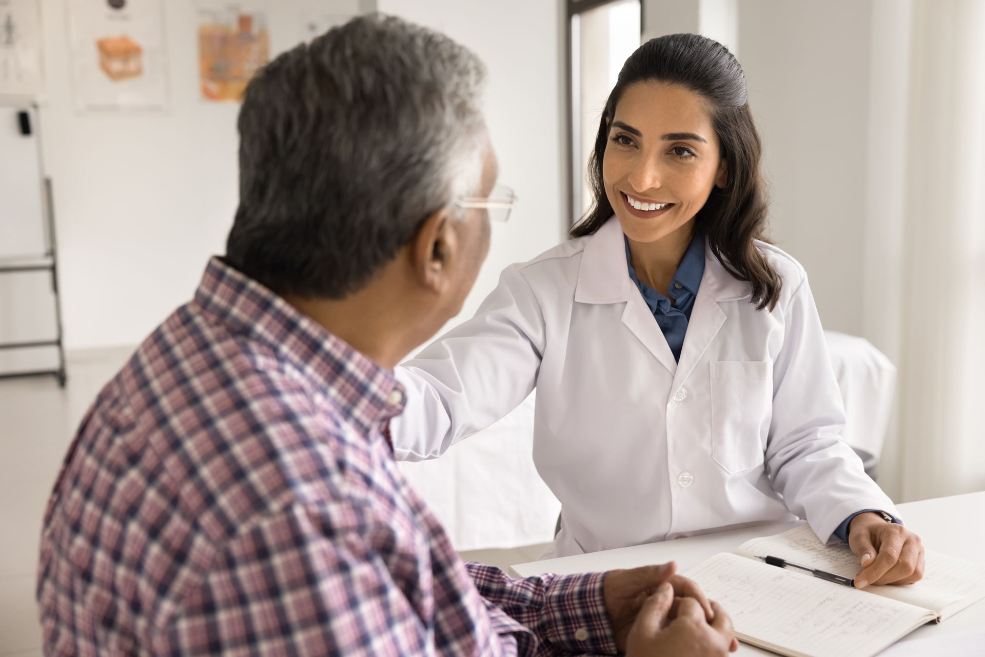 Doctor talking with a patient in a bright clinic office